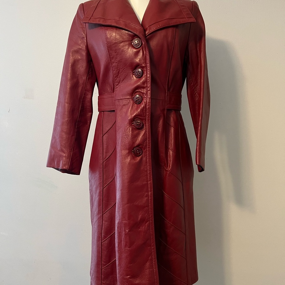Gorgeous vintage red leather knee length coat by 24k. Fits like a medium.
